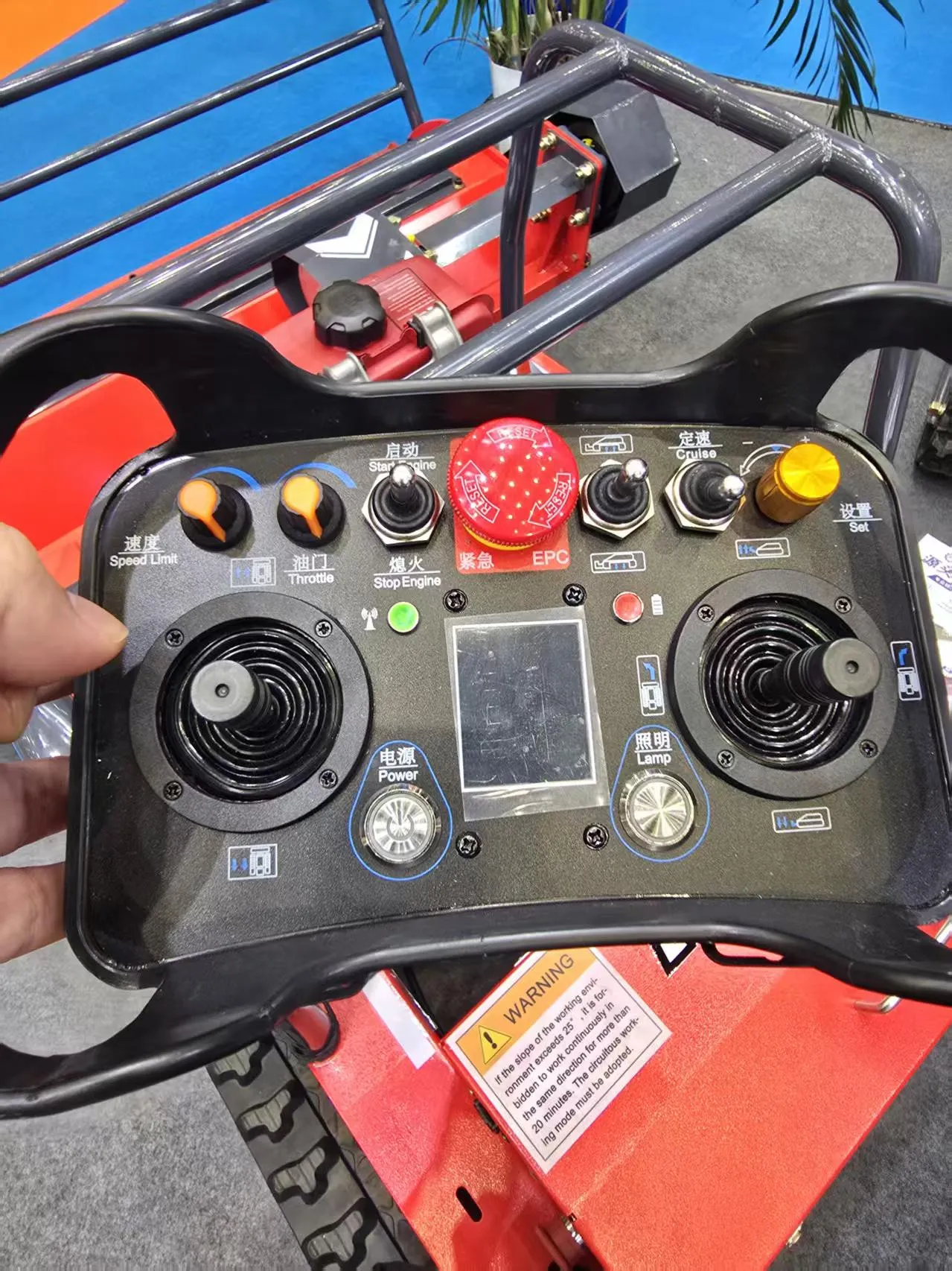 Control unit for a remote-controlled mower photographed on site.